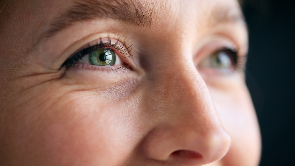 Macro,Studio,Expression,Shot,Of,Woman's,Smiling,Eyes,With,Close Employee being coached on AI